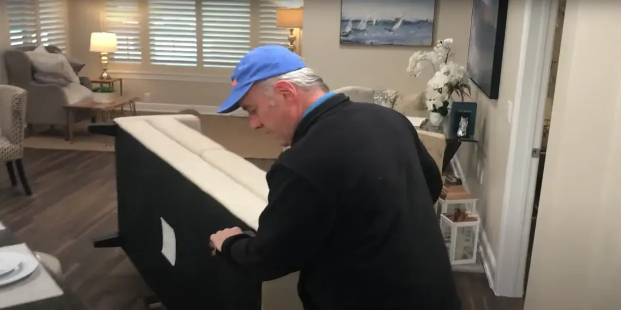 Professional movers carrying boxes